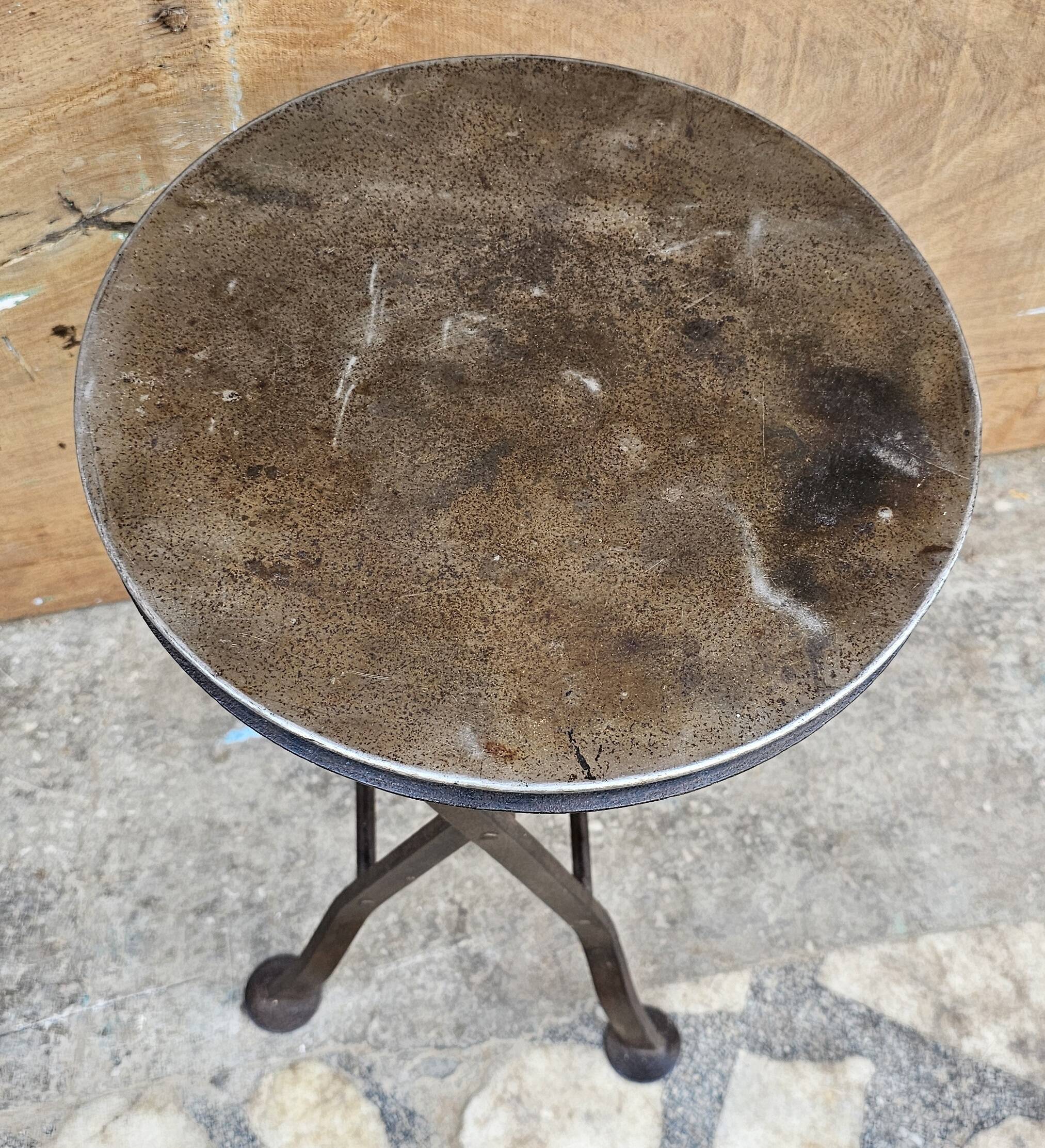 Old industrial folding steel stool