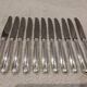 11 silver-plated metal lunch knives by Ravinet Coquille, 18cm