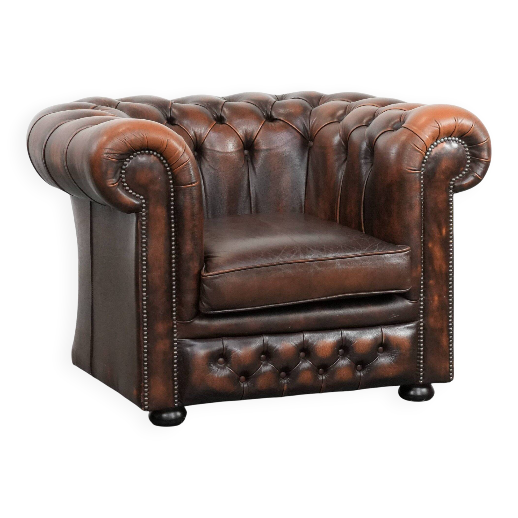 Brown Chesterfield armchair made of cowhide leather in English style