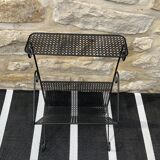 Black perforated metal magazine rack