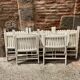 Five wooden garden armchairs