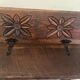 Small antique wooden bench with a folding backrest.