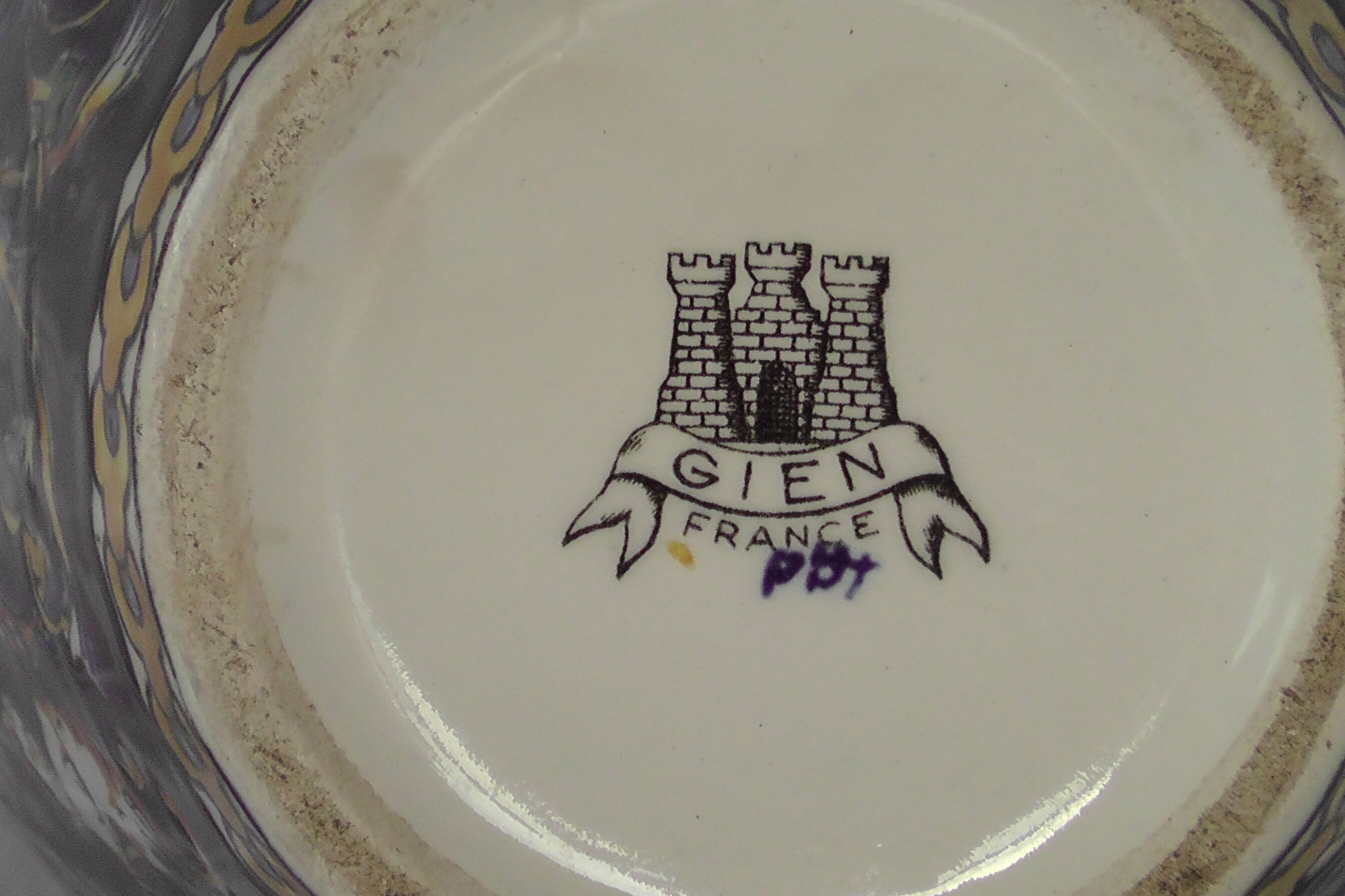 Gien earthenware vase on XX century blue background