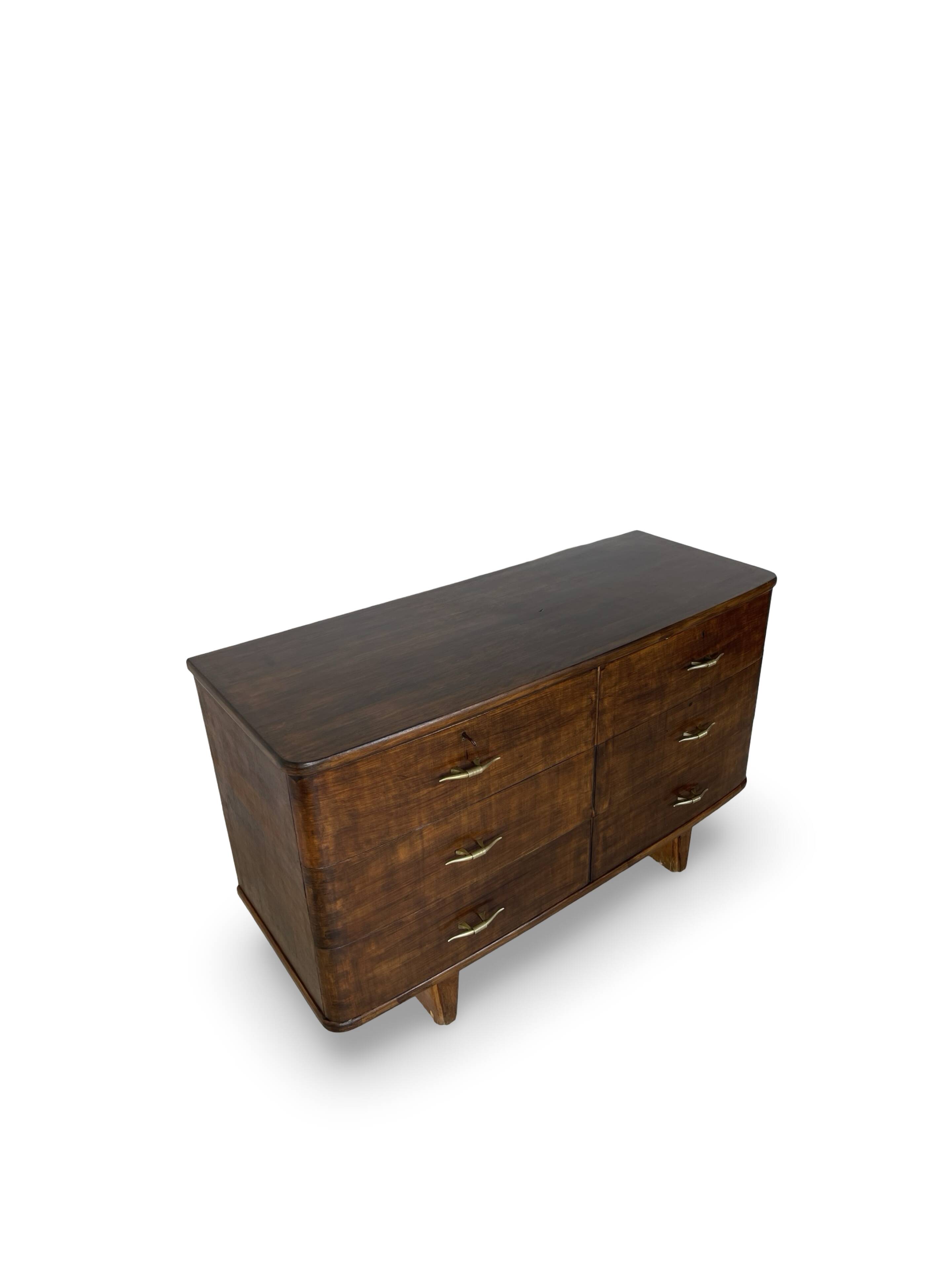 A vintage Italian chest of drawers, made of veneered walnut and solid wood,
