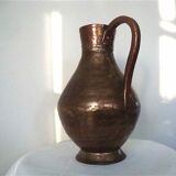 Skidded copper pitcher