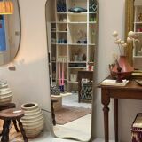 Long trapezoidal mirror in curved gilded brass, art deco modernist