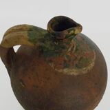 Old goat, jug, gargoulette, water pitcher in glazed green sandstone. nineteenth century