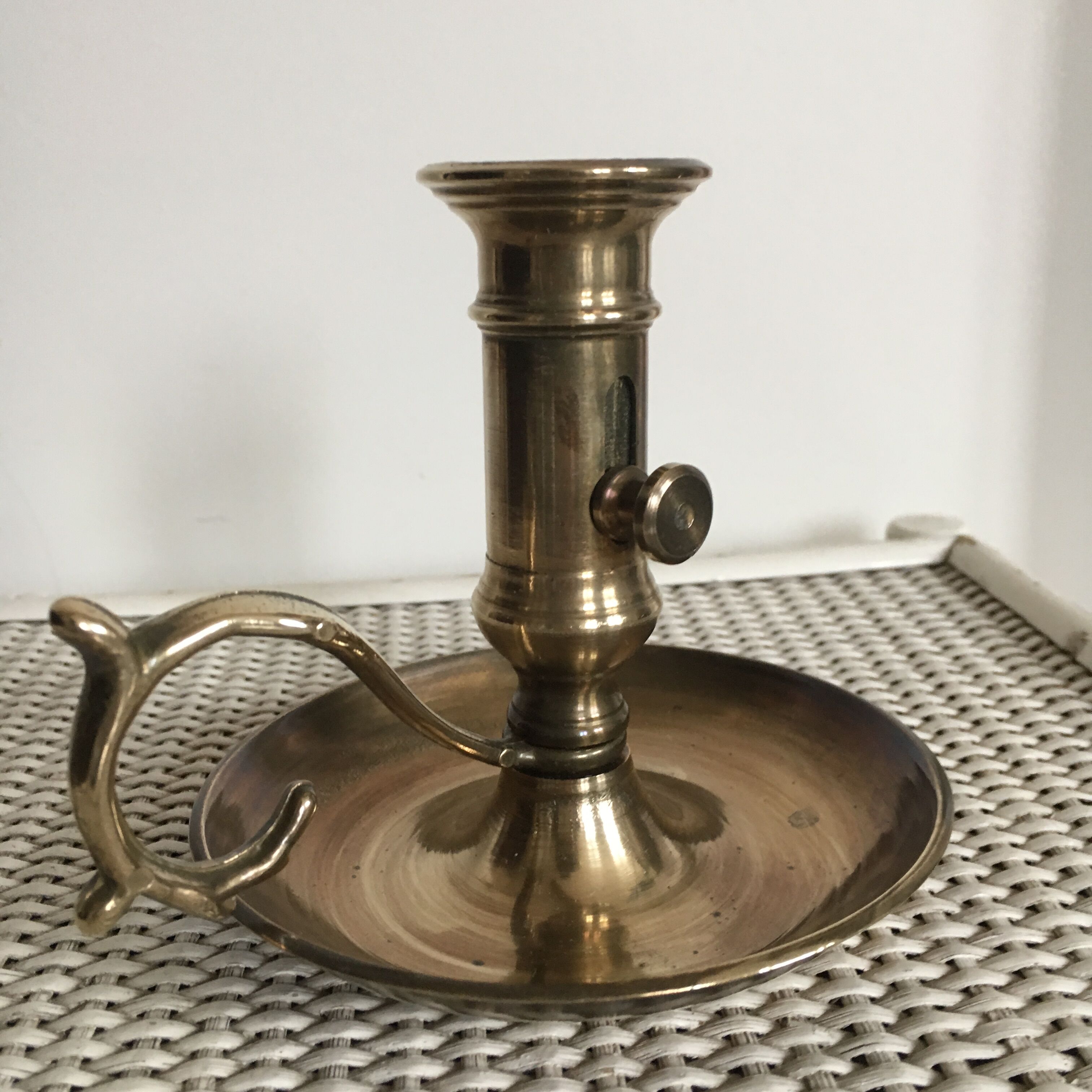 Old brass candlestick called "rat tail"