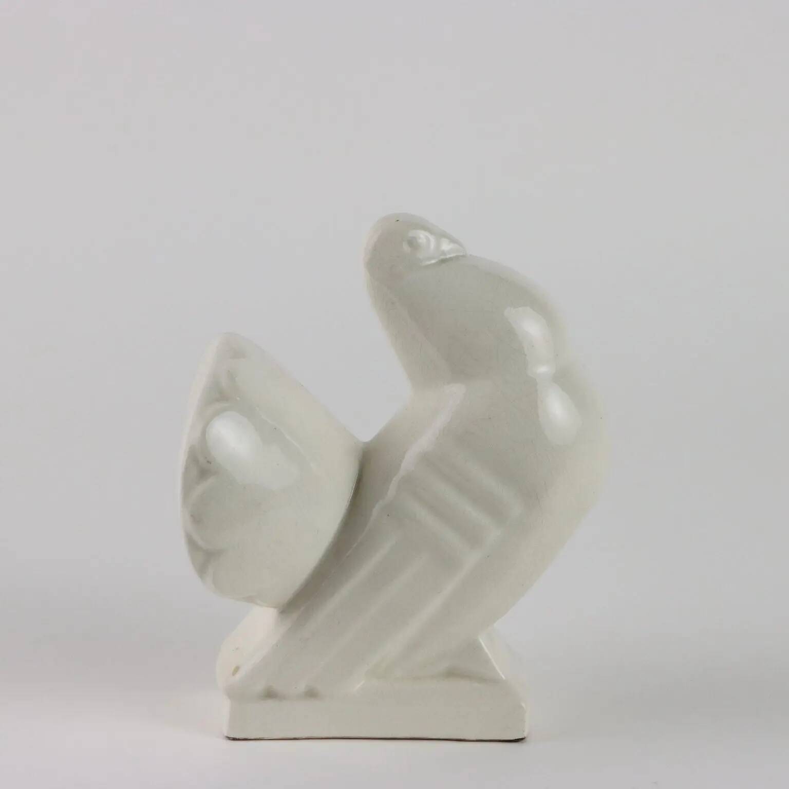 Ancient ceramic pigeon sculpture by George Ventrillon for Saint Clément.