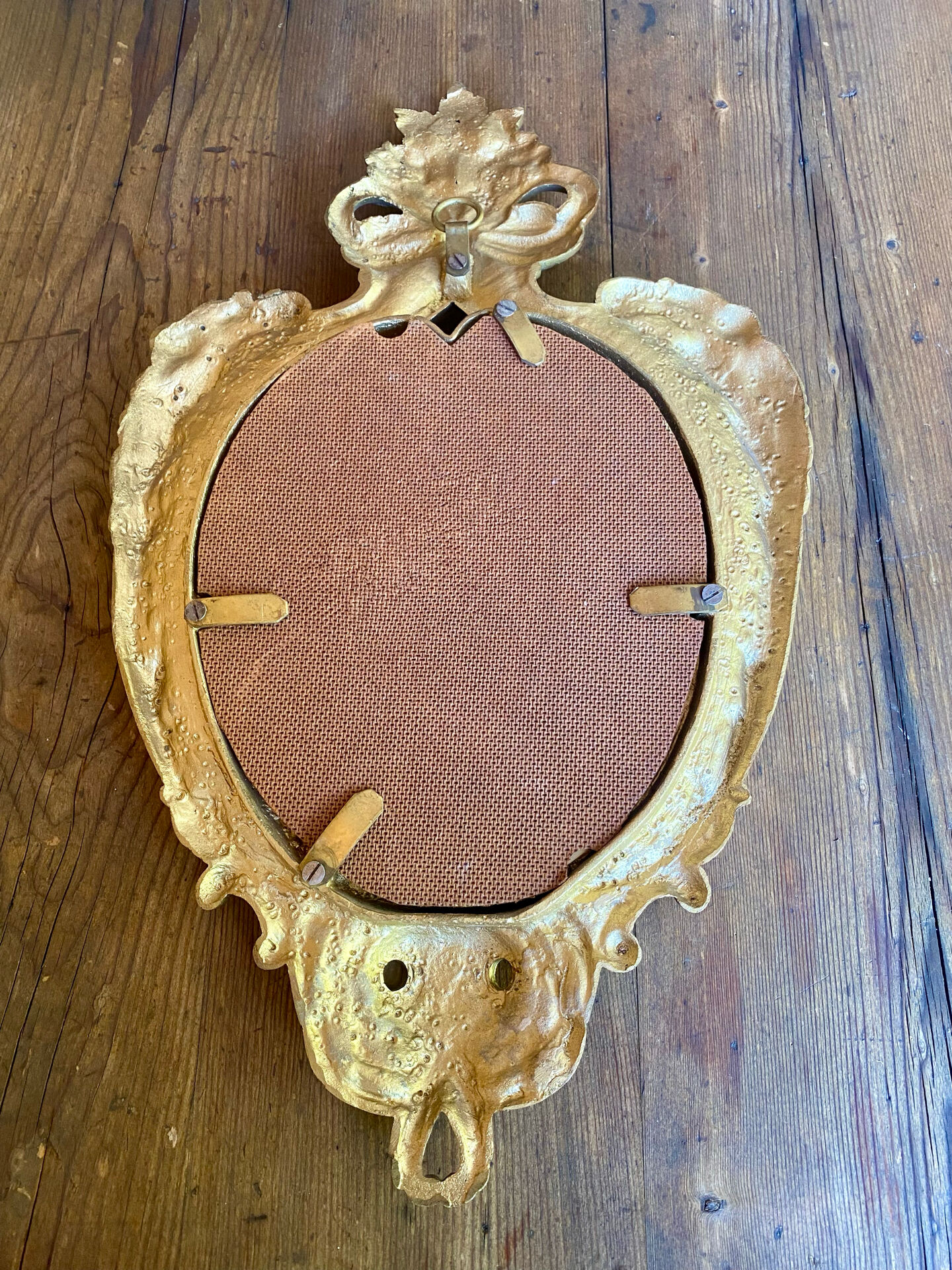 oval decorative wall mirror in Louis XV style