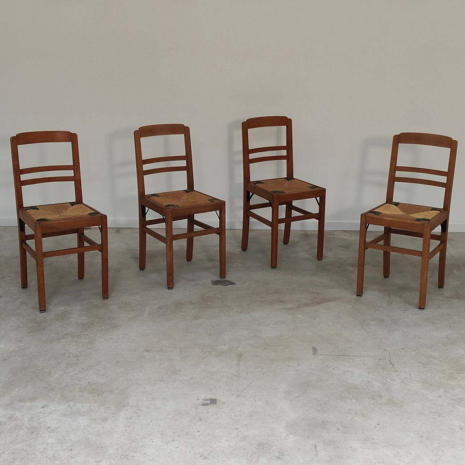 Set of 4 designer oak and straw chairs from the 1950s