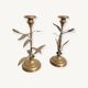 Pair of brass candlesticks with plant decoration