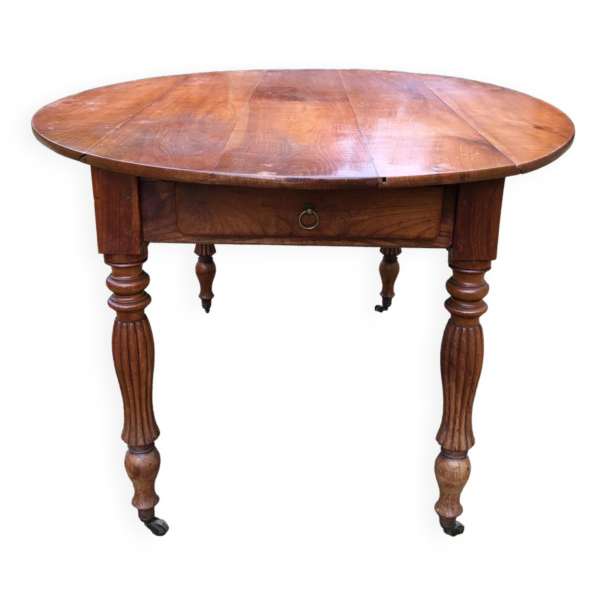 Louis Philippe oval drop-leaf table in solid cherry wood with 2 drawers.