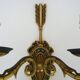 Pair of double-light Empire style arrow wall lights in bronze. Early 20th century
