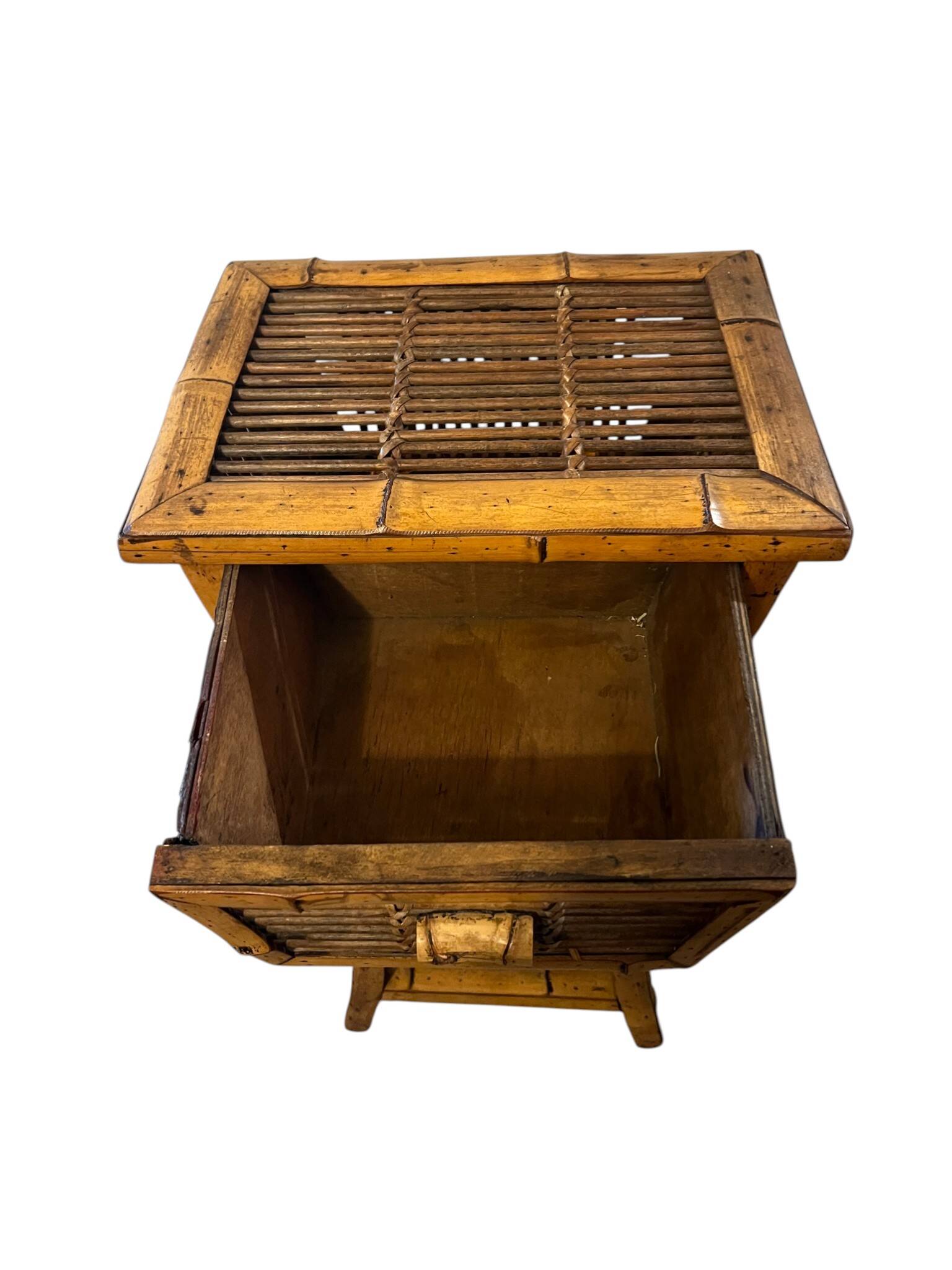 Vintage bamboo side table with drawer from the 20th century.