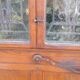 Oak entrance door and its frame and transom, wrought iron gates