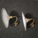 Wall sconces with scalloped opaline lampshades.