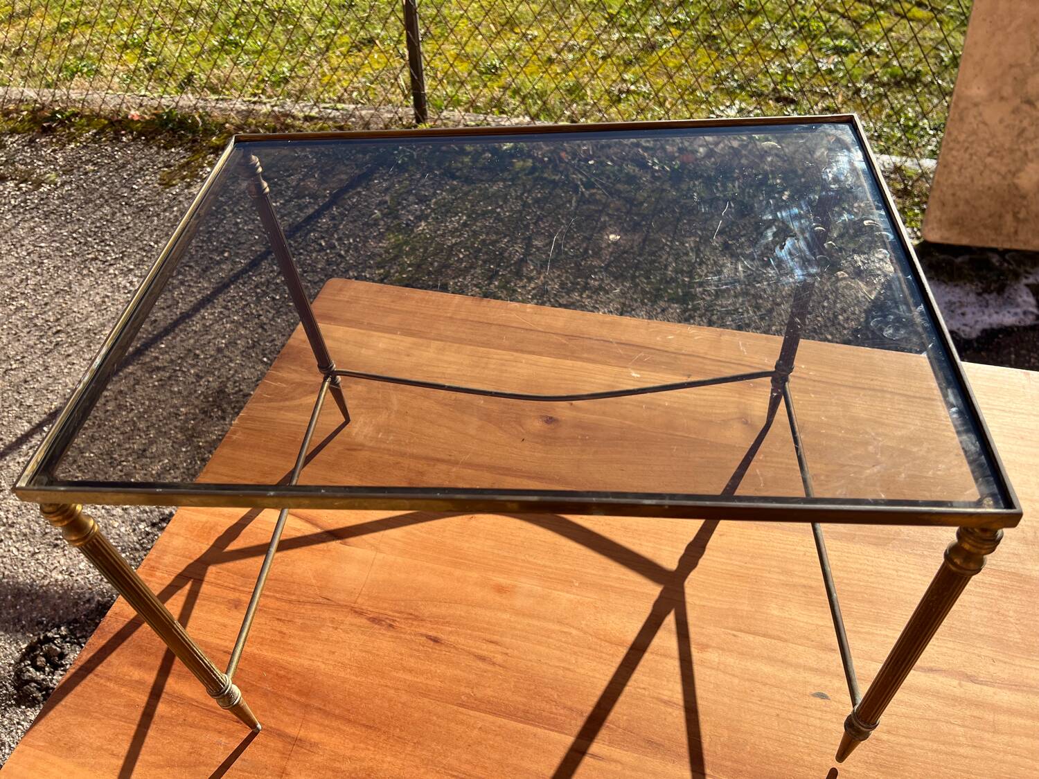 Brass side table with smoked glass.