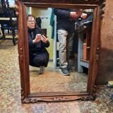 Mirror in golden wood