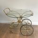 Neo classical style table in silver and gold metal and glass