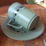 A pair of vintage glazed stoneware cups and saucers.