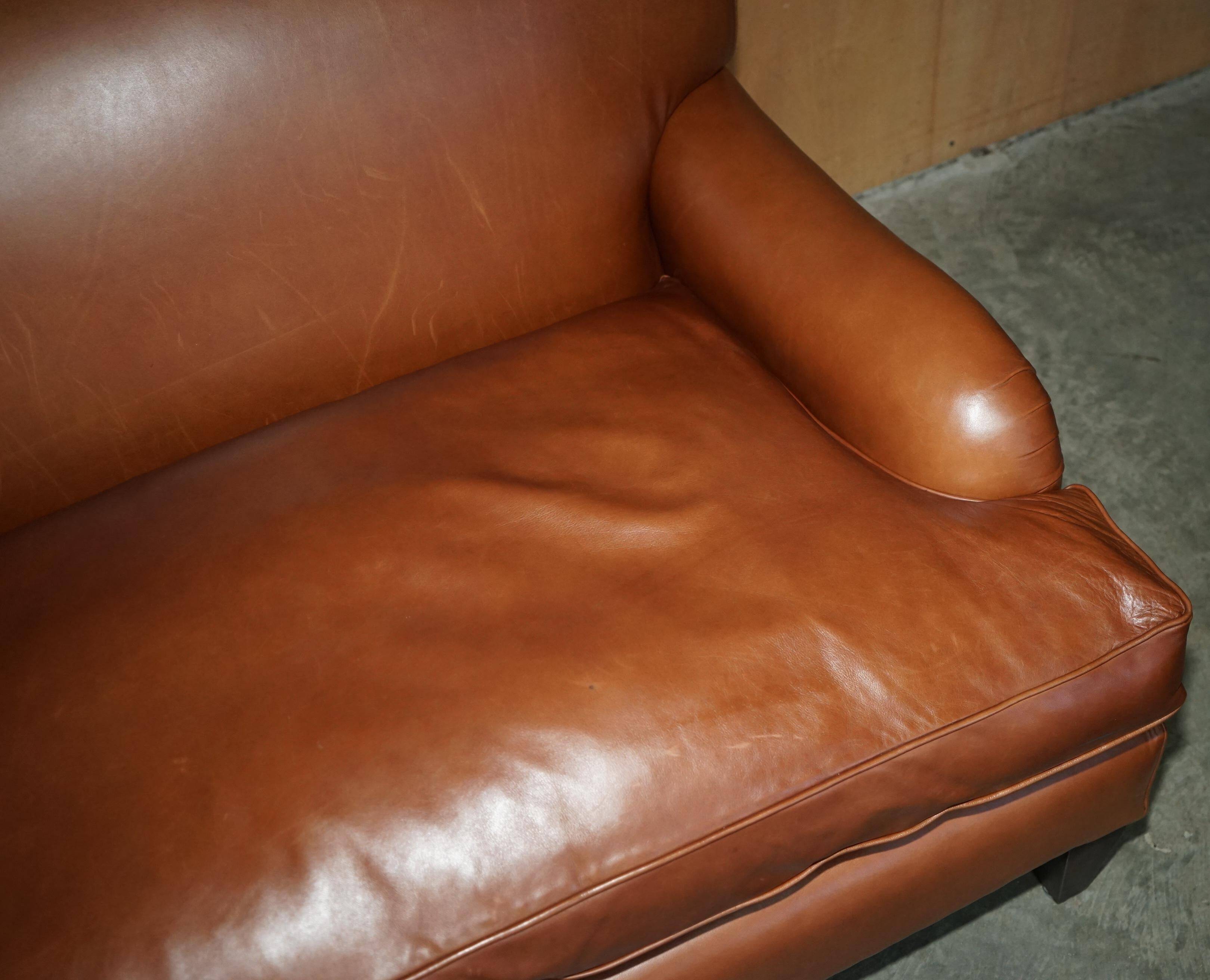 Two-seater leather armchair in Howard style by George Smith.