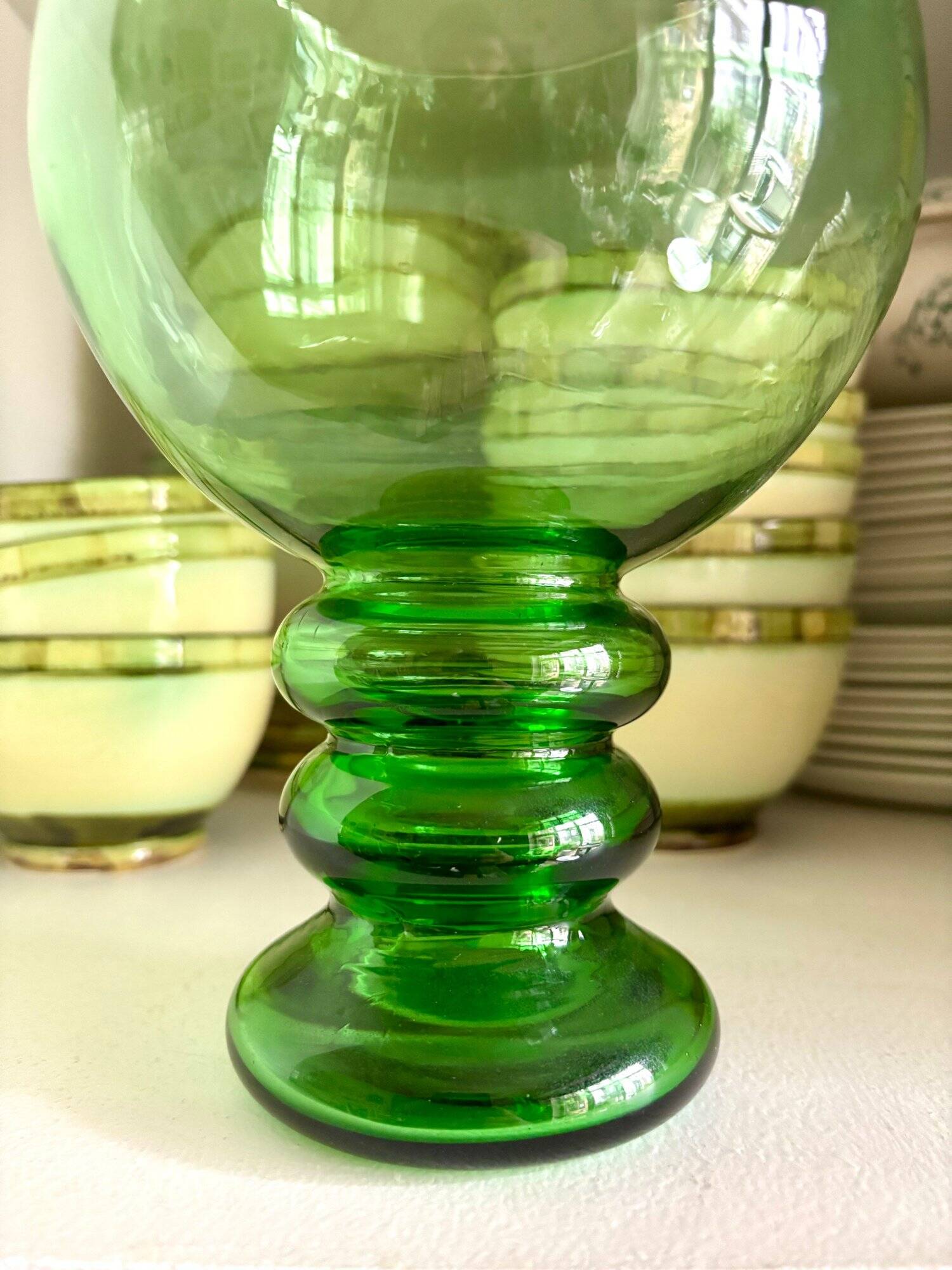 Green glass ball vase