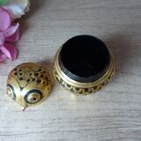 Old small black and gold lacquered wooden box in the shape of an owl