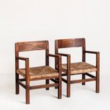 Pair of rustic armchairs in solid wood and straw seats. France, 1940s
