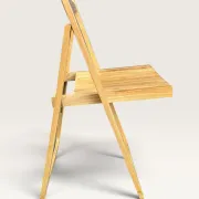 Blonde wooden folding chair in the style of Aldo Jacober.