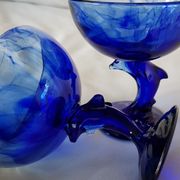 Set of 2 dolphin dessert cups in blue glass.