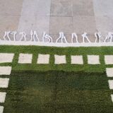 Handwoven Moroccan rug, natural wool, 250cm x 150cm, elegant decoration.
