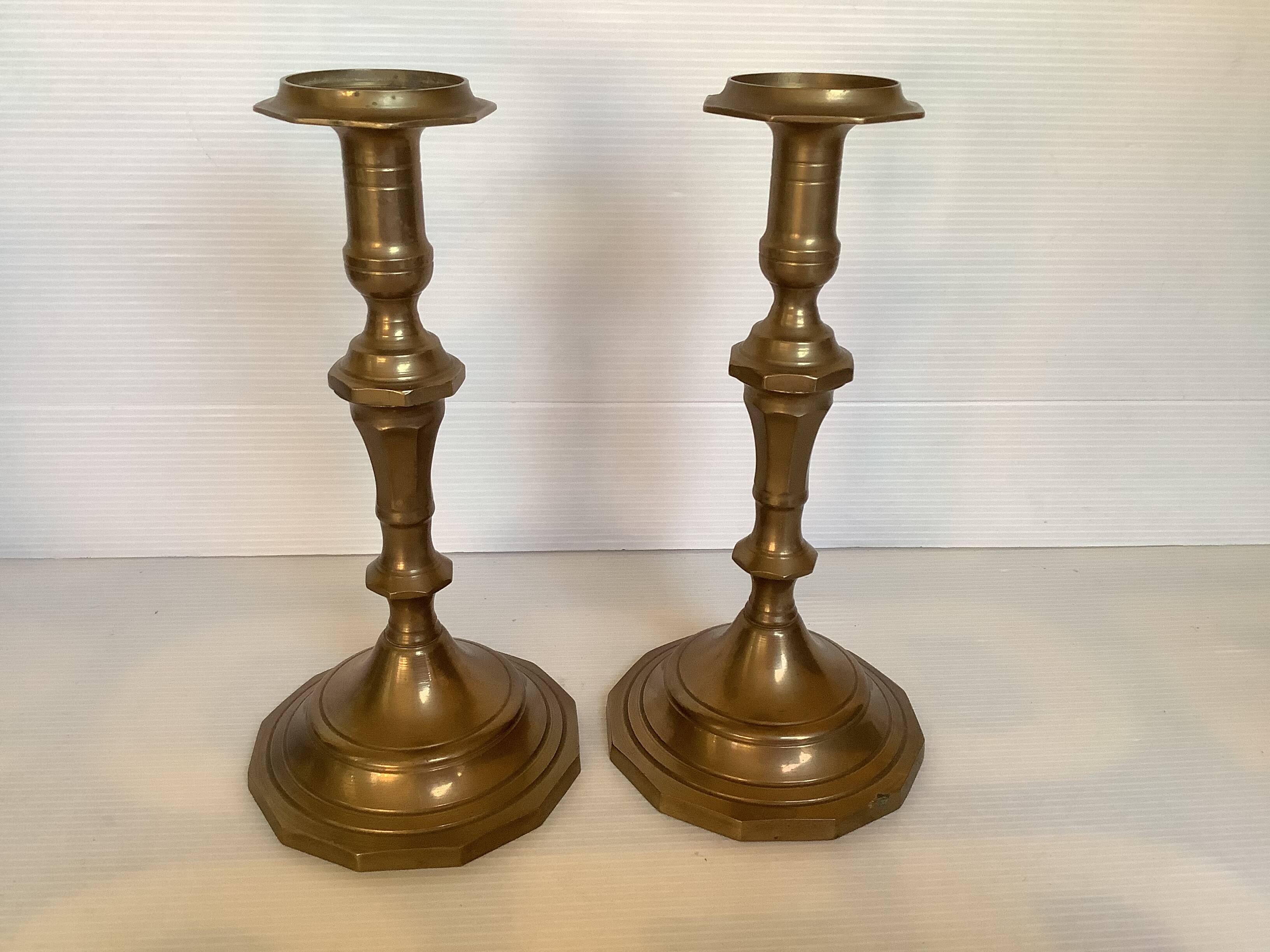 Four brass candle holders