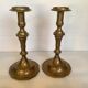 Four brass candle holders