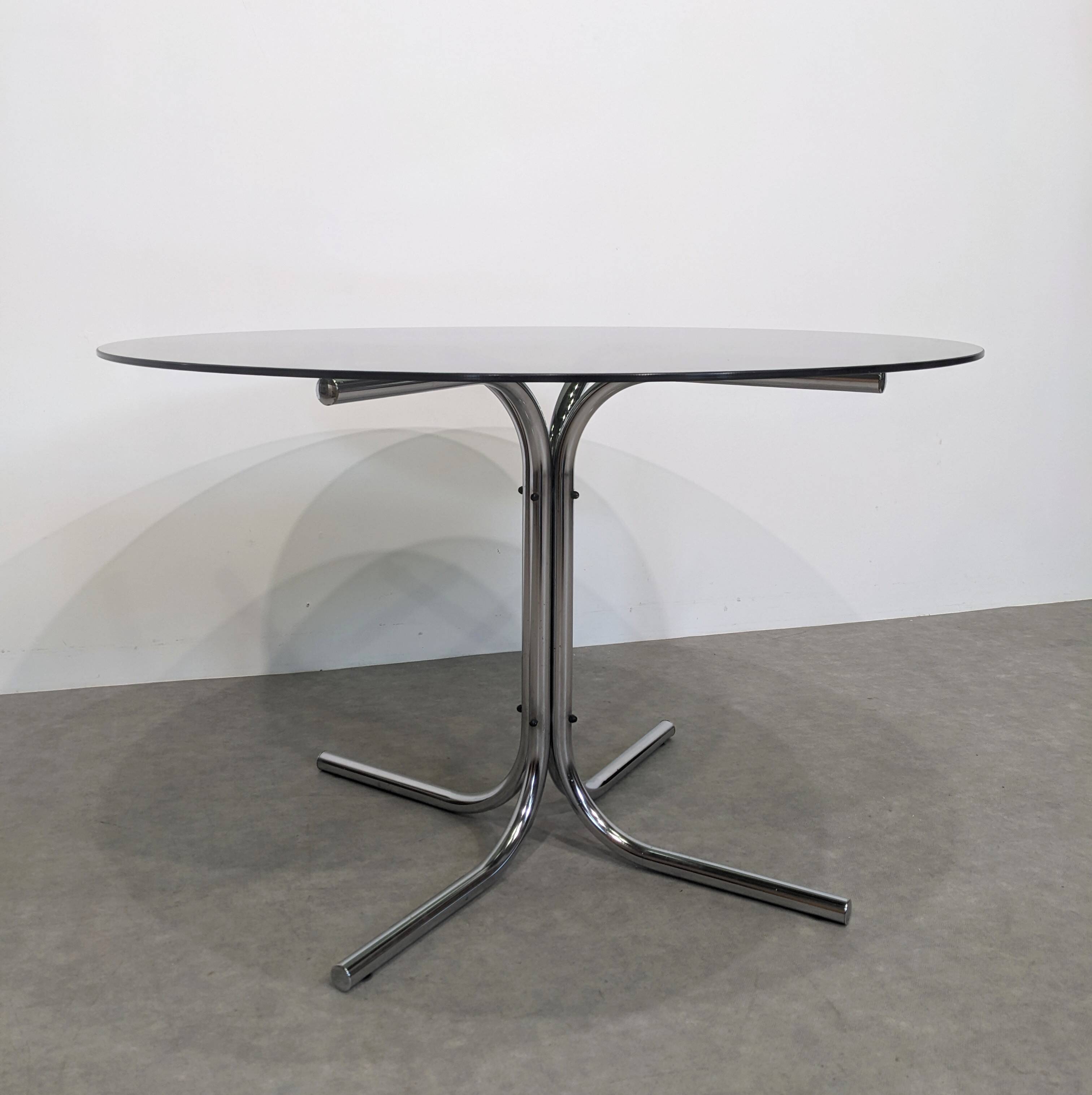 70s round table with smoked glass and chrome