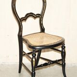 Four antique Regency bergère chairs with mother-of-pearl inlay.