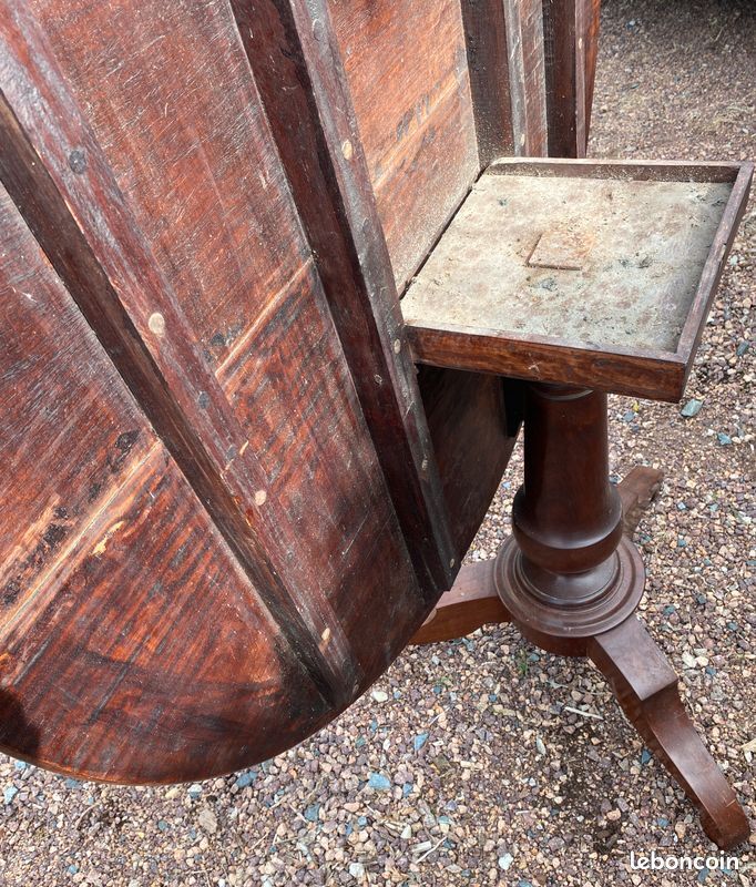 Old and large round winegrower's table made of wood.