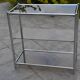 Console/étagère sur pied en acier chromé et verre fumé