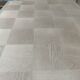 Oak dining table with a checkerboard top and extensions.