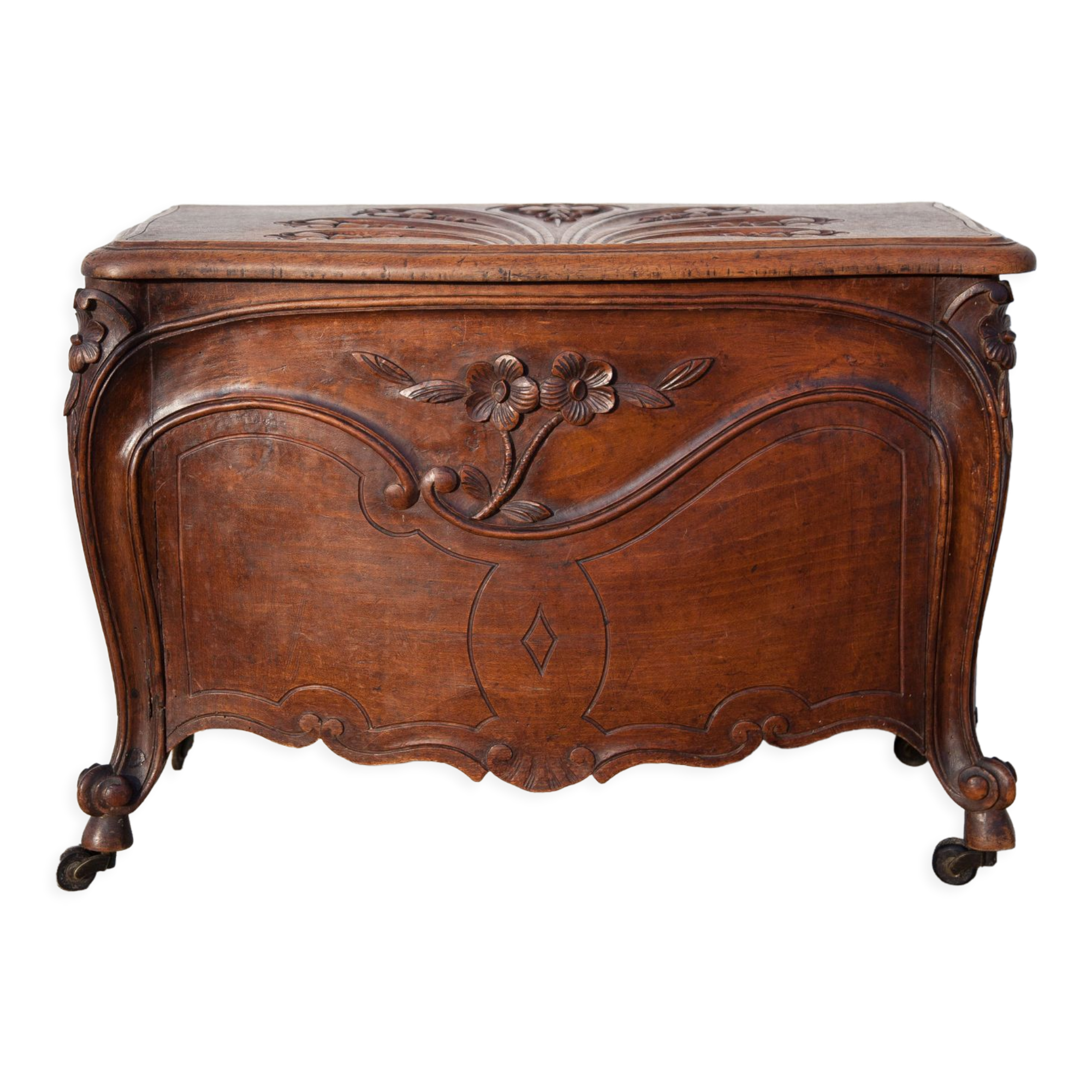 Old chest, carved wooden chest, curved chest on wheels, interior decoration