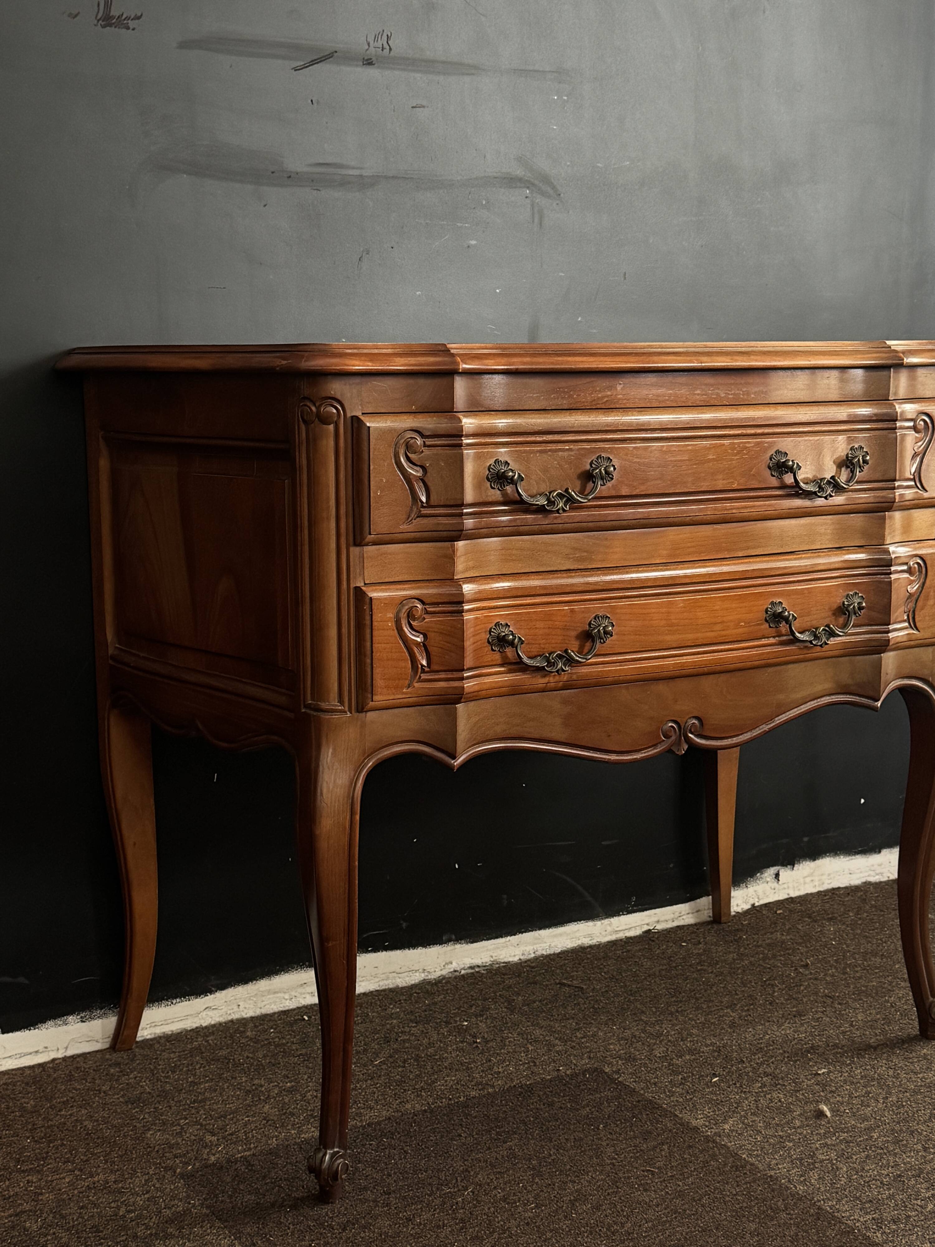 Carved wooden chest of drawers