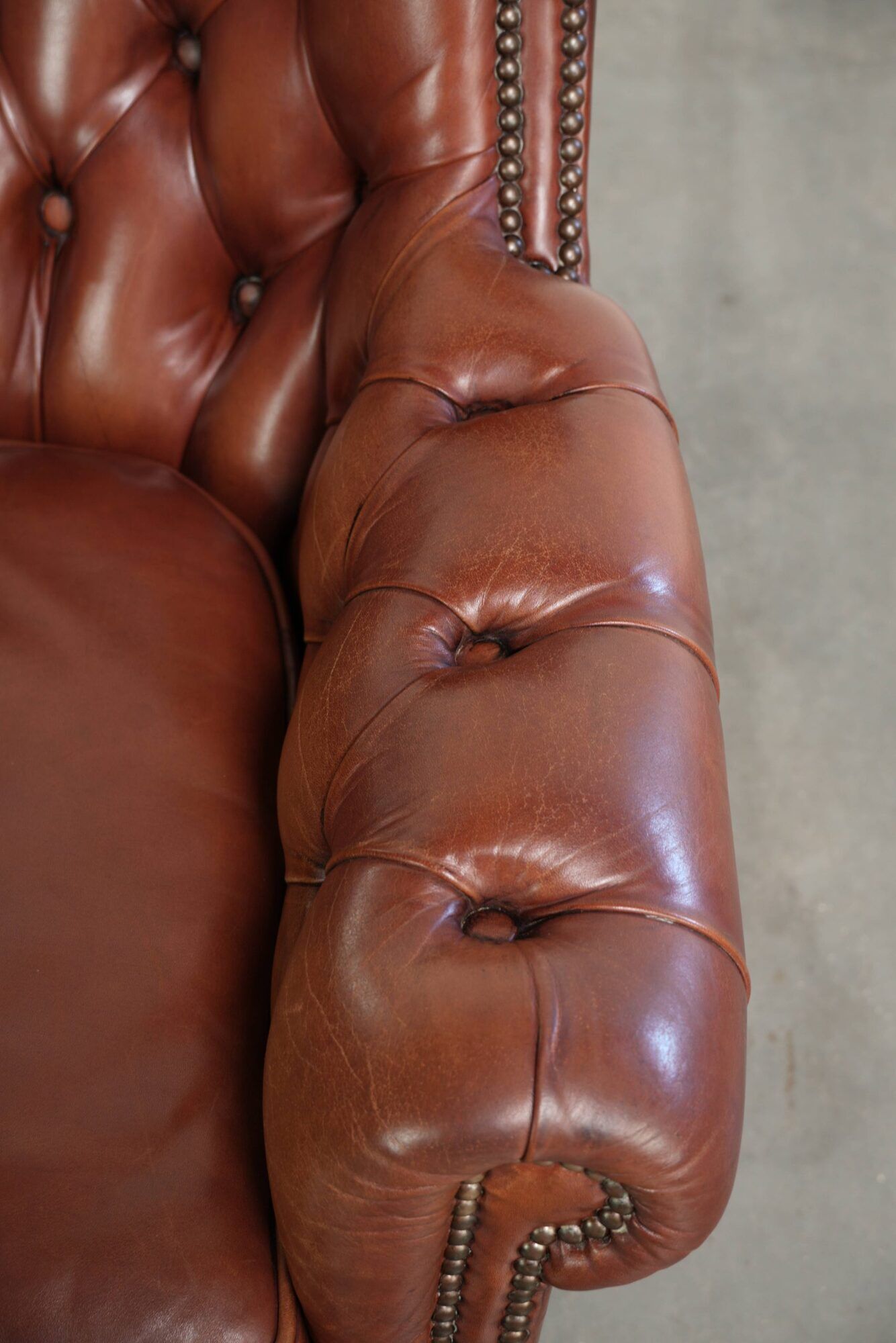 Cognac-coloured cow leather Chesterfield armchair in English style