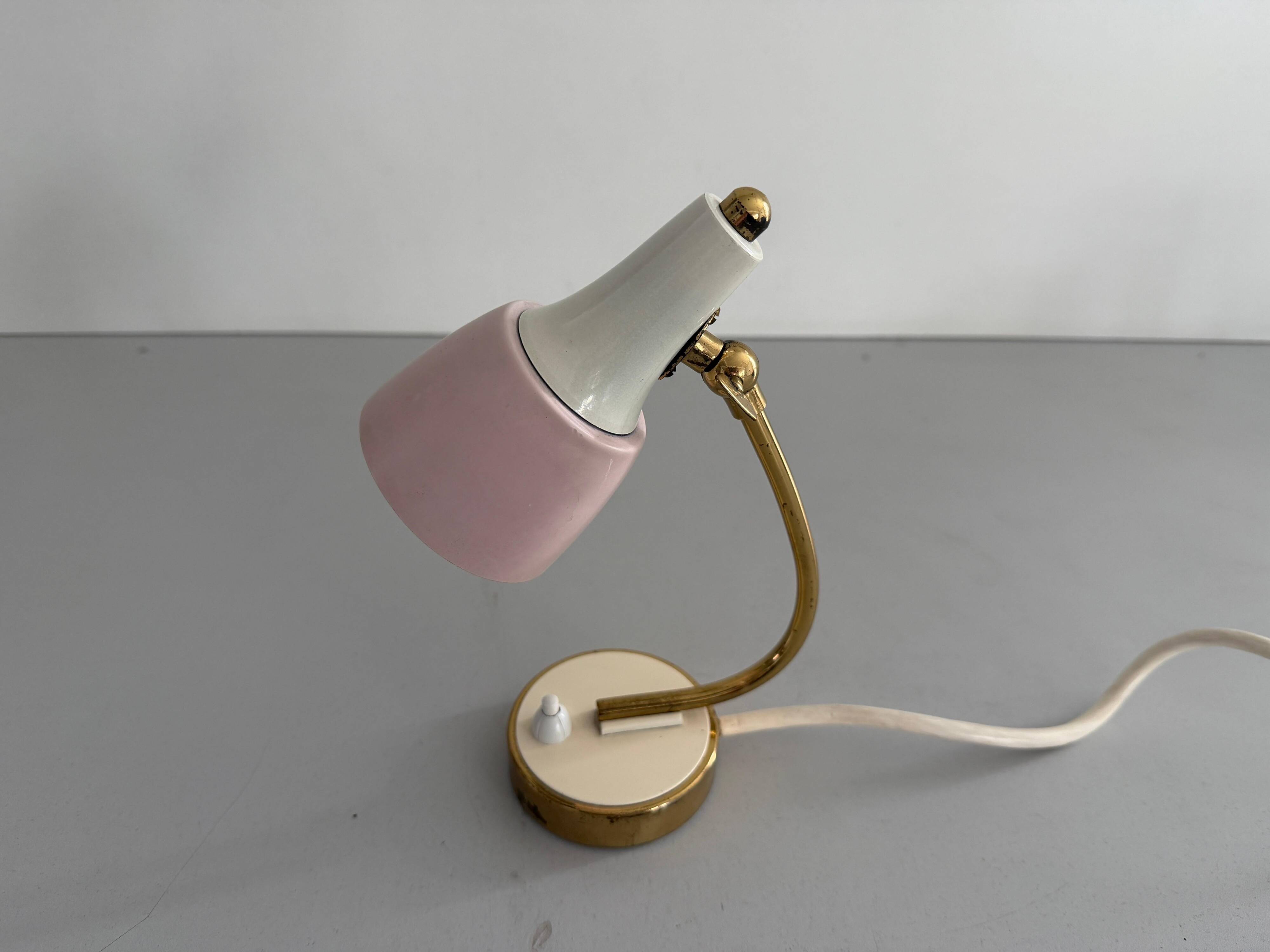 Simple table lamp with a pink metal head and brass body, 1960s, Germany.