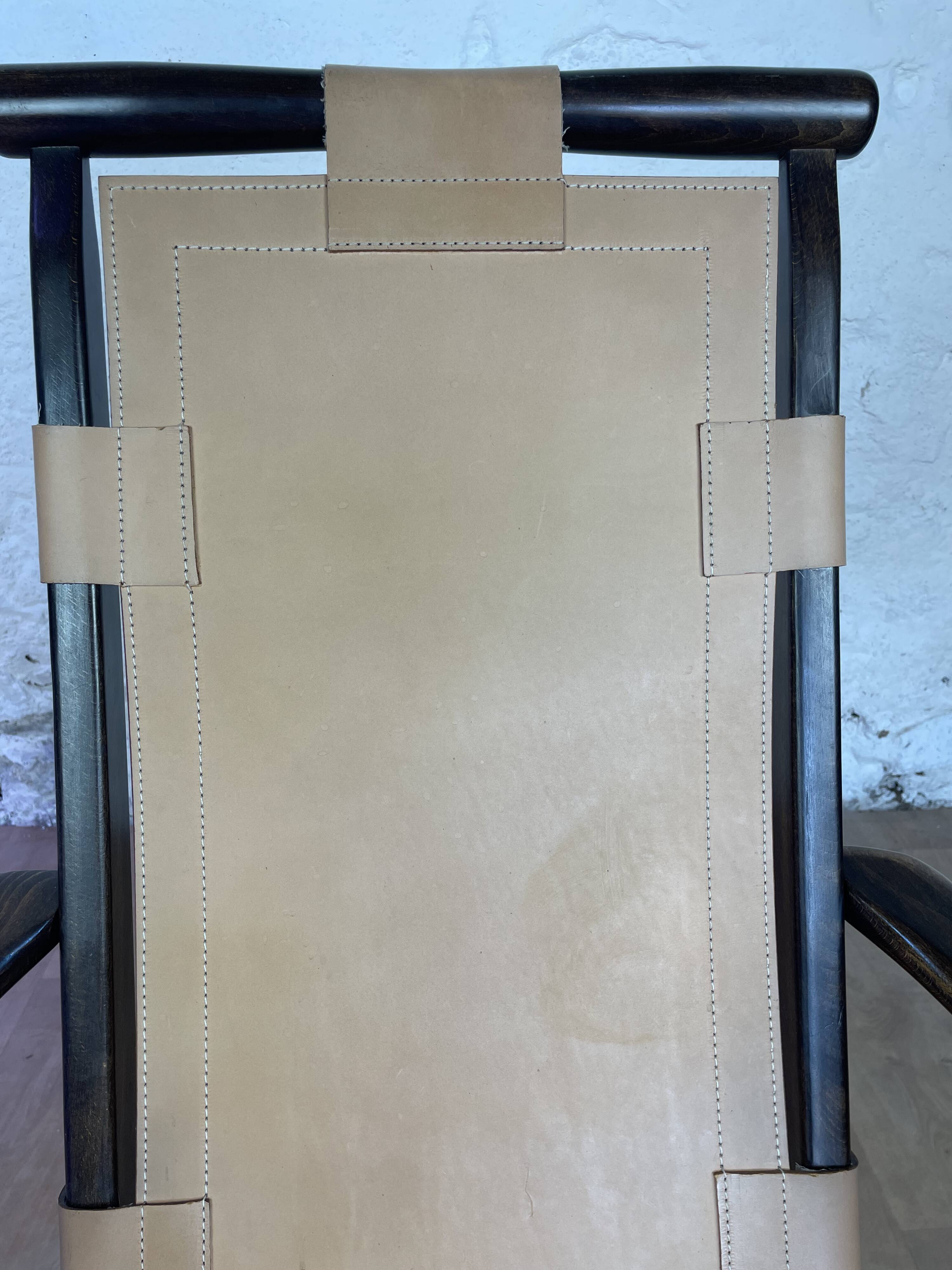 Colonial style leather armchair and ottoman