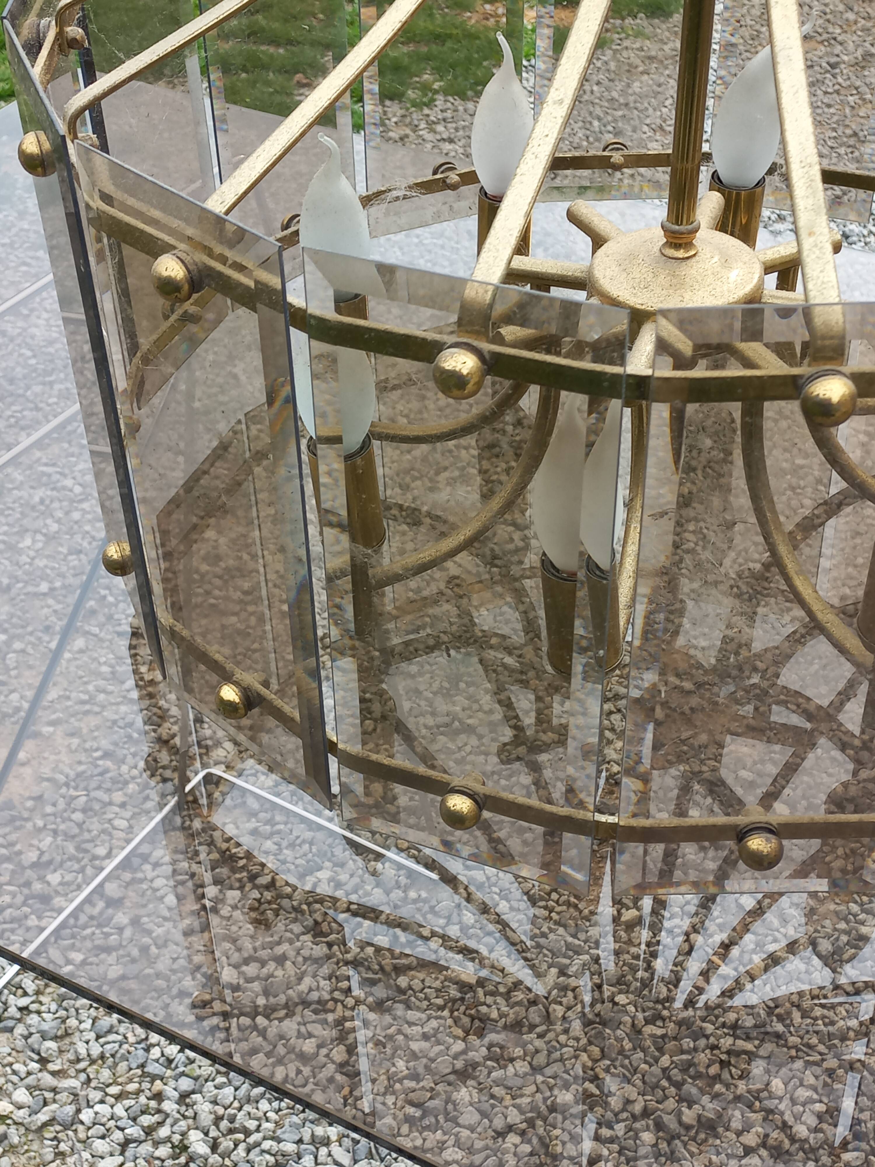 70s designer chandelier with smoked glass plates and gold metal frame