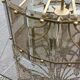 70s designer chandelier with smoked glass plates and gold metal frame
