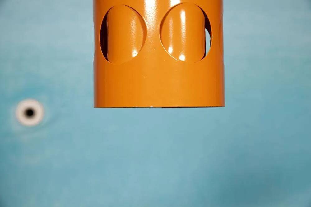 Vintage orange suspension light in a 1970s space age style.