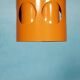 Vintage orange suspension light in a 1970s space age style.