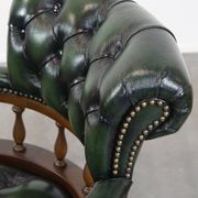 Dark green cowhide leather and wood chesterfield office chair on wheels