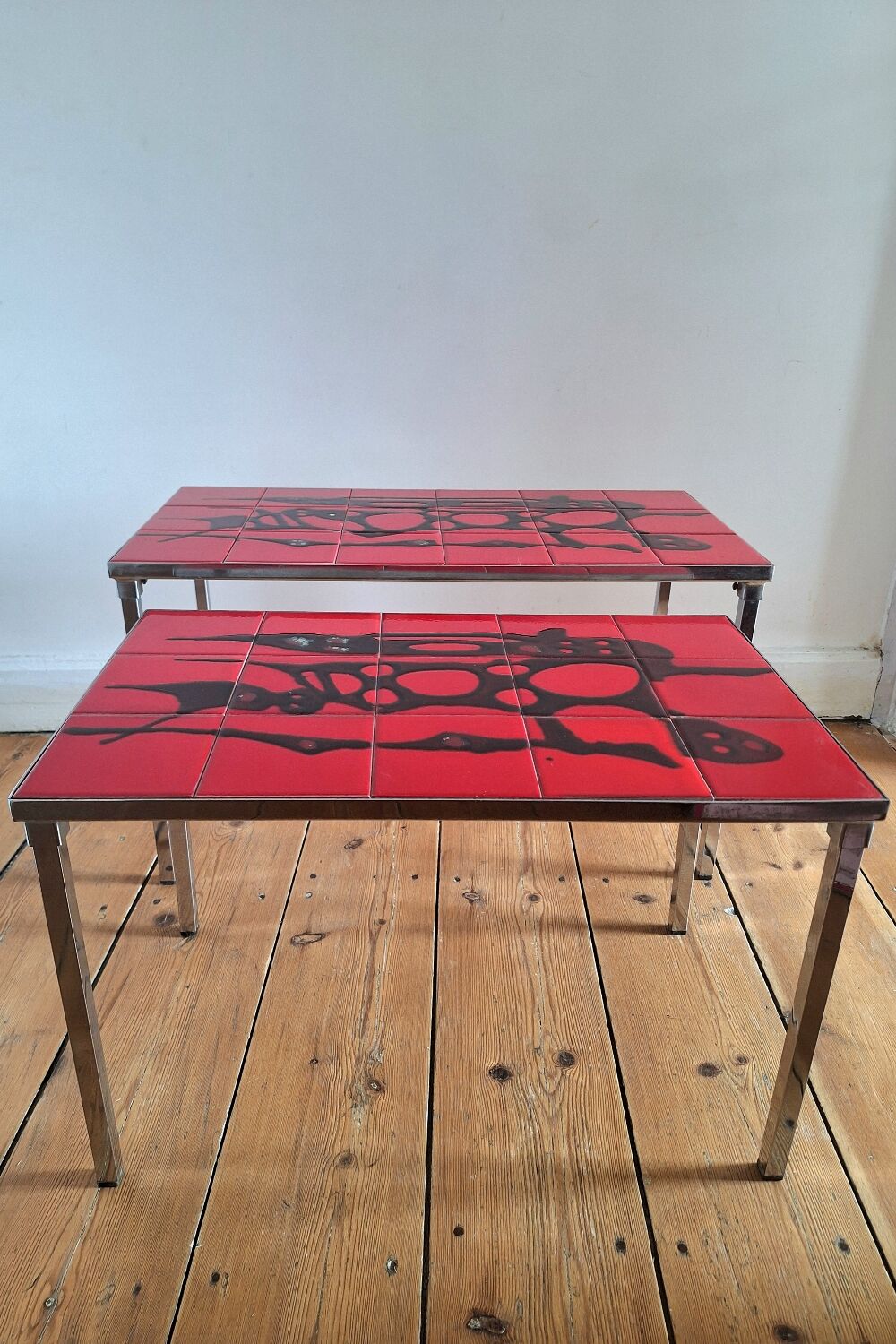 Pair of nesting coffee tables, vintage ceramic furniture.